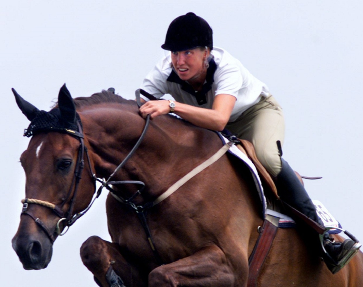 Amy Millar, daughter of former Canadian horse jumping champion Ian Millar, on her horse Manhattan takes one of the jumps during qualifying rounds at the Capital Classic Horse Jumping Championship in Ottawa Thursday July 15, 1999.(CP PHOTO/Tom Hanson)