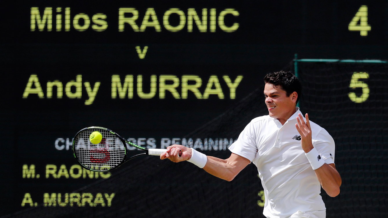 Milos Raonic of Canada hits a return to Andy Murray of Britain during the men's singles final on the fourteenth day of the Wimbledon Tennis Championships in London, Sunday, July 10, 2016. (AP Photo/Ben Curtis)