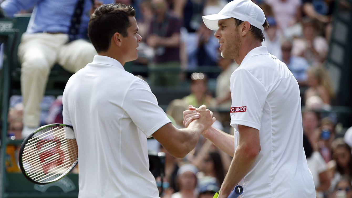 Milos Raonic of Canada, left, shakes hands at match point after beating Sam Querrey of the U.S in their men's singles match on day ten of the Wimbledon Tennis Championships in London, Wednesday, July 6, 2016. (AP Photo/Alastair Grant)