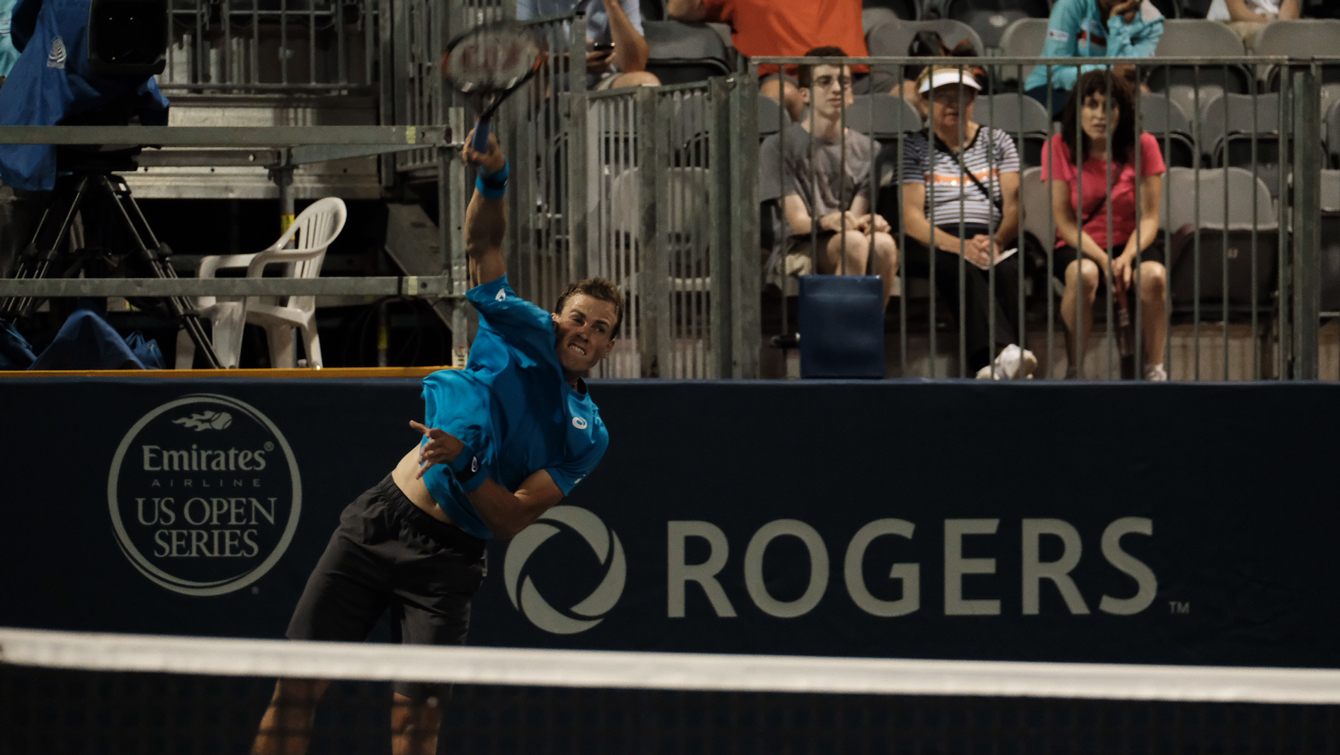 Canada's Vasek Pospisil serves in doubles play on July 29, 2016 at the Rogers Cup in Toronto . (Thomas Skrlj/COC)