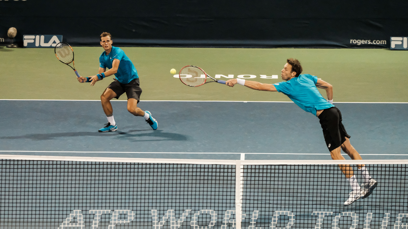 Canada’s Daniel Nestor (right) and Vasek Pospisil (left) in action against Tomas Berdych and Radek Stepanek of the Czech Republic on July 29, 2016 at the Rogers Cup in Toronto. (Thomas Skrlj/COC)