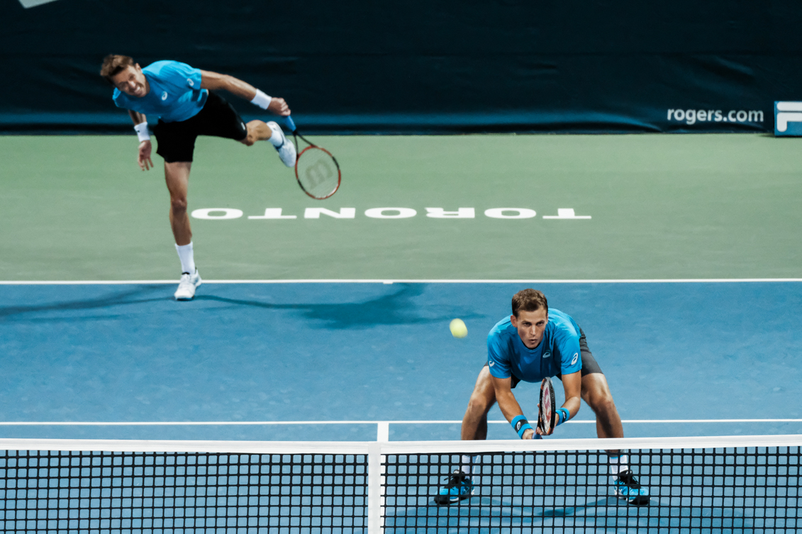 Canada’s Vasek Pospisil and Daniel Nestor play doubles in the quarterfinals of the Rogers Cup in Toronto on July 29, 2016. (Thomas Skrlj/COC)