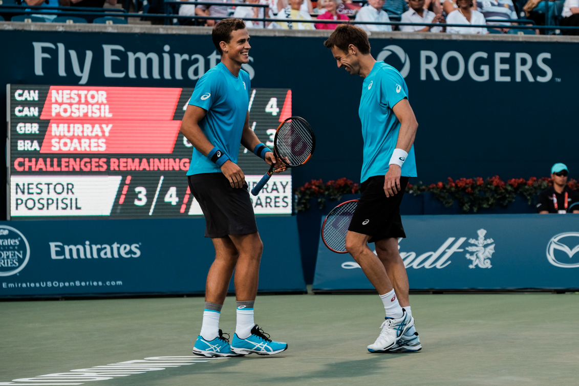 Canada’s Vasek Pospisil and Daniel Nestor play doubles in the semifinals of the Rogers Cup in Toronto on July 30, 2016. (Thomas Skrlj/COC)