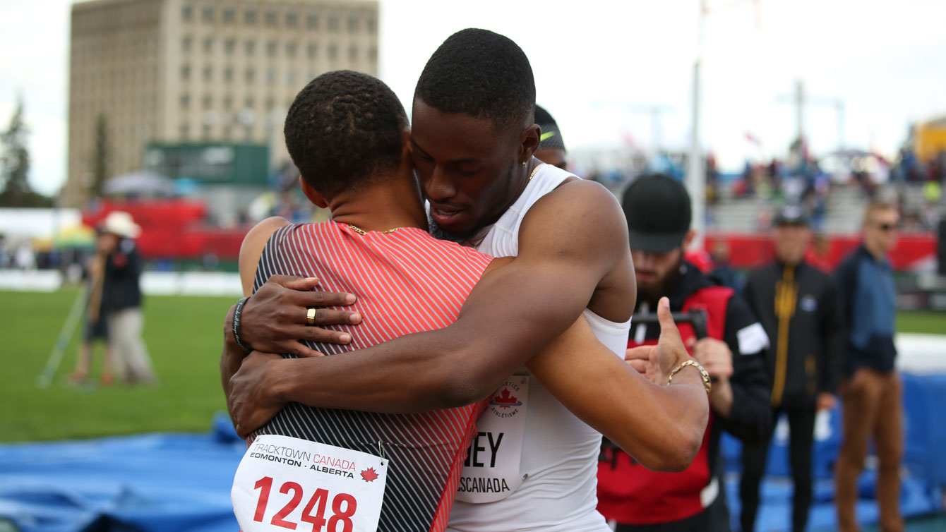 Brendon Rodney (right) hugs Andre De Grasse after the 200m final at Olympic trials on July 10, 2016. 