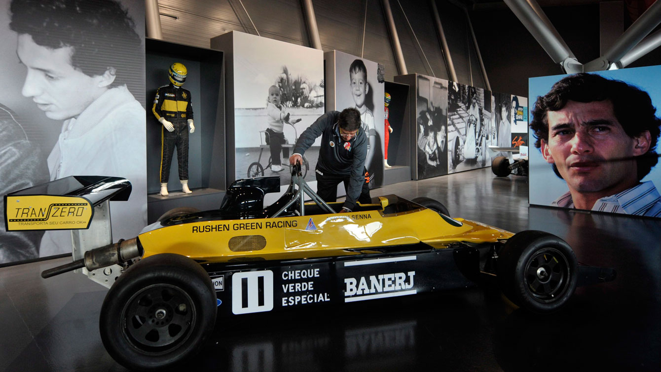 A caretaker tends to Ayrton Senna's 1983 race car on April 30, 2014 ahead of a gathering at the Imola track in Italy to commemorate the 20th anniversary of Senna's death. 