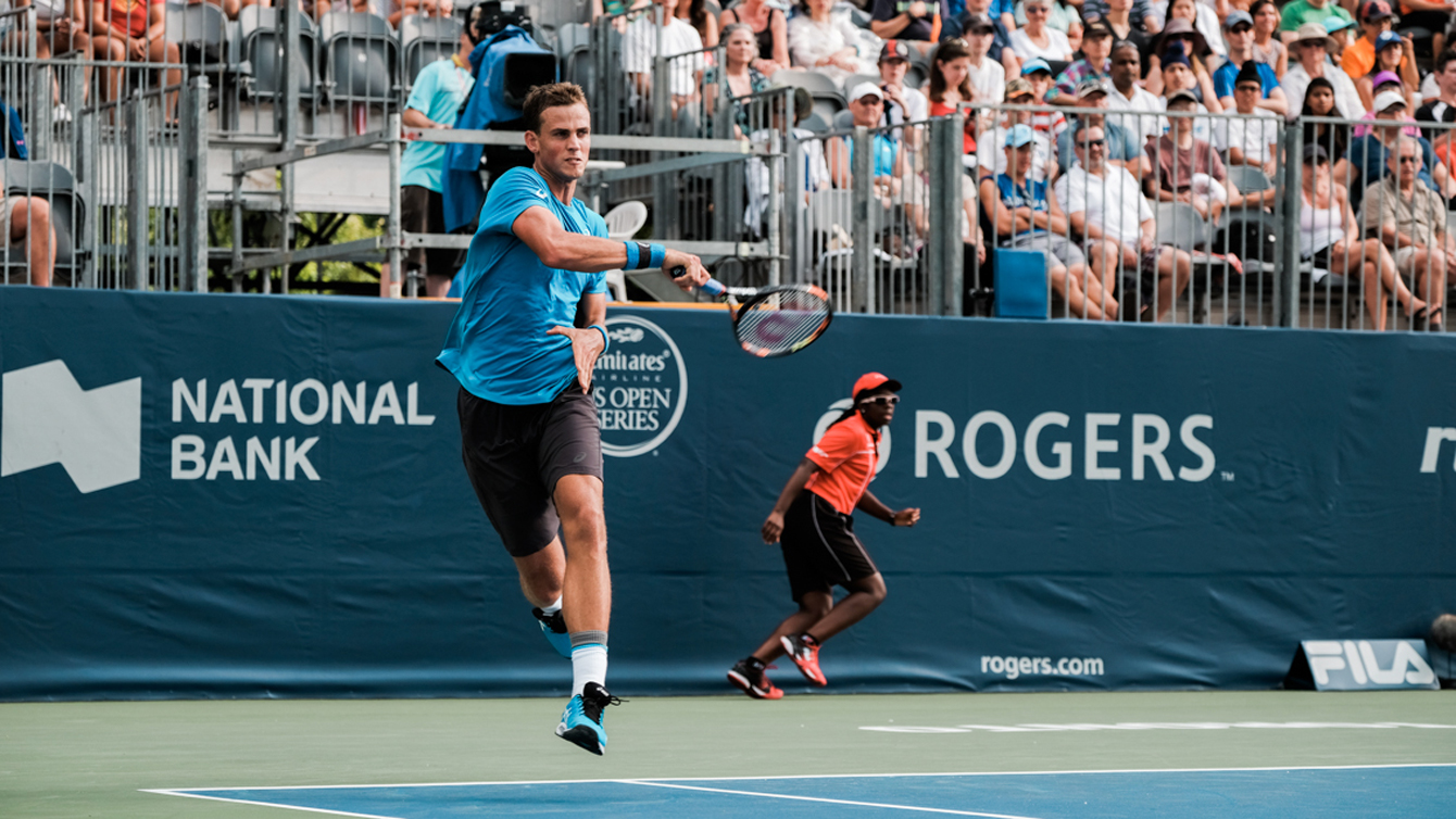 Canada's Vasek Pospisil returns a shot against France's Gael Monfils on July 27, 2016 at the Rogers Cup in Toronto. (Thomas Skrlj/COC)