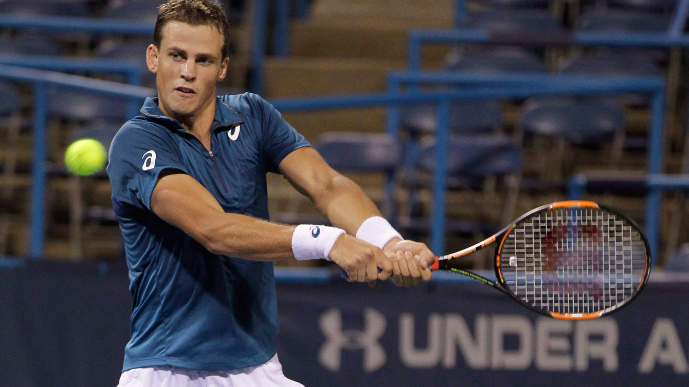 Vasek Pospisil returns the ball to John Isner, of the United States, during the Citi Open tennis tournament, in Washington on August 7, 2015. THE CANADIAN PRESS/AP-Luis M. Alvarez, File