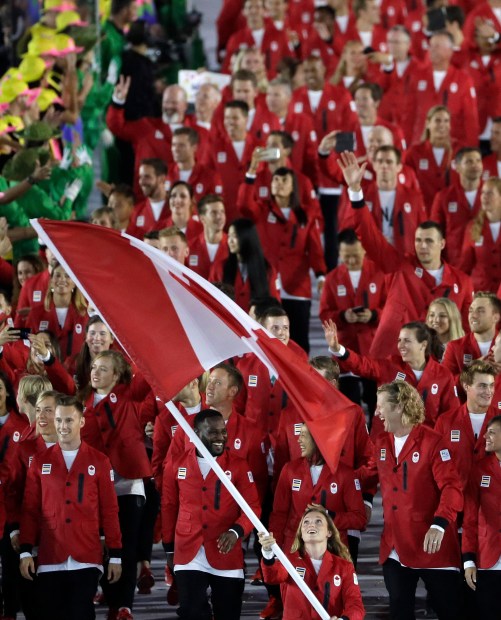 Rosannagh Maclennan carries the flag of Canada during the opening ceremony for the 2016 Summer Olympics in Rio de Janeiro, Brazil, Friday, Aug. 5, 2016. (AP Photo/Matt Slocum)