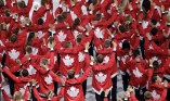 Team Canada wave as they walk into the stadium during the opening ceremony for the 2016 Summer Olympics in Rio de Janeiro, Brazil, Friday, Aug. 5, 2016. (AP Photo/Matthias Schrader)