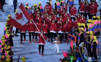 Rosie MacLennan leads Team Canada into the stadium during the opening ceremonies at the 2016 Olympic Games in Rio de Janeiro, Brazil on Friday, Aug. 5, 2016. THE CANADIAN PRESS/Sean Kilpatrick