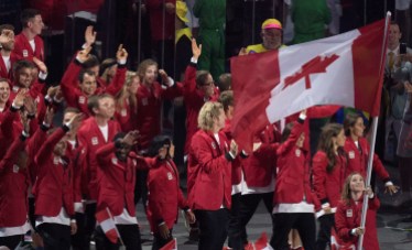 OLY Rio Opening Ceremony 20160805 Rosie MacLennan carries the flag as she leads Canada into the opening ceremonies for the 2016 Summer Olympics Friday August 5, 2016 in Rio de Janeiro, Brazil. THE CANADIAN PRESS/Frank Gunn