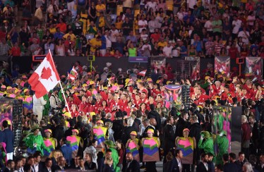 Rosie MacLennan leads team Canada into the stadium during the opening ceremonies at the 2016 Olympic Games in Rio de Janeiro, Brazil on Friday, Aug. 5, 2016. THE CANADIAN PRESS/Sean Kilpatrick