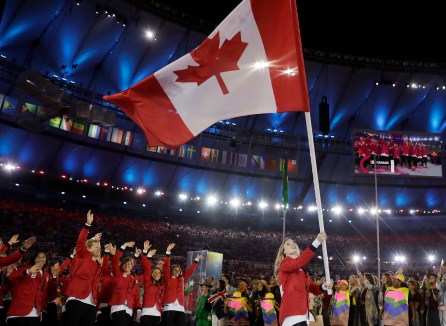 Rosannagh Maclennan carries the flag of Canada during the opening ceremony for the 2016 Summer Olympics in Rio de Janeiro, Brazil, Friday, Aug. 5, 2016. (AP Photo/David J. Phillip)