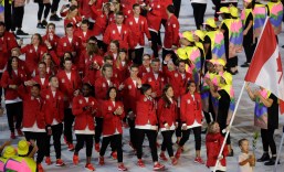 Rosannagh Maclennan carries the flag of Canada during the opening ceremony for the 2016 Summer Olympics in Rio de Janeiro, Brazil, Friday, Aug. 5, 2016. (AP Photo/Patrick Semansky)