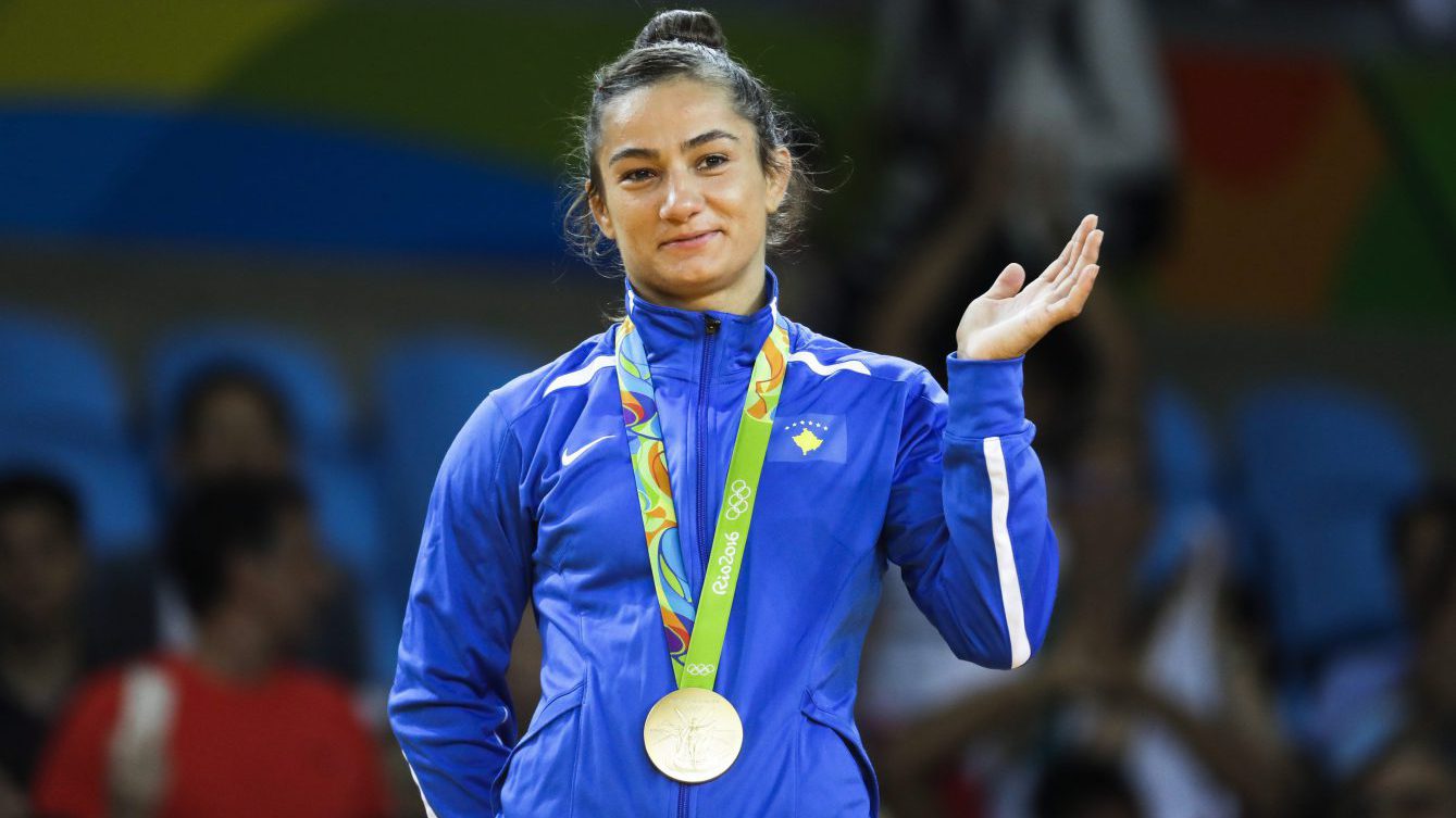 Kosovo's Majlinda Kelmendi receives the gold medal after winning the women's 52-kg judo competition at the 2016 Summer Olympics in Rio de Janeiro, Brazil, Sunday, Aug. 7, 2016. (AP Photo/Markus Schreiber)