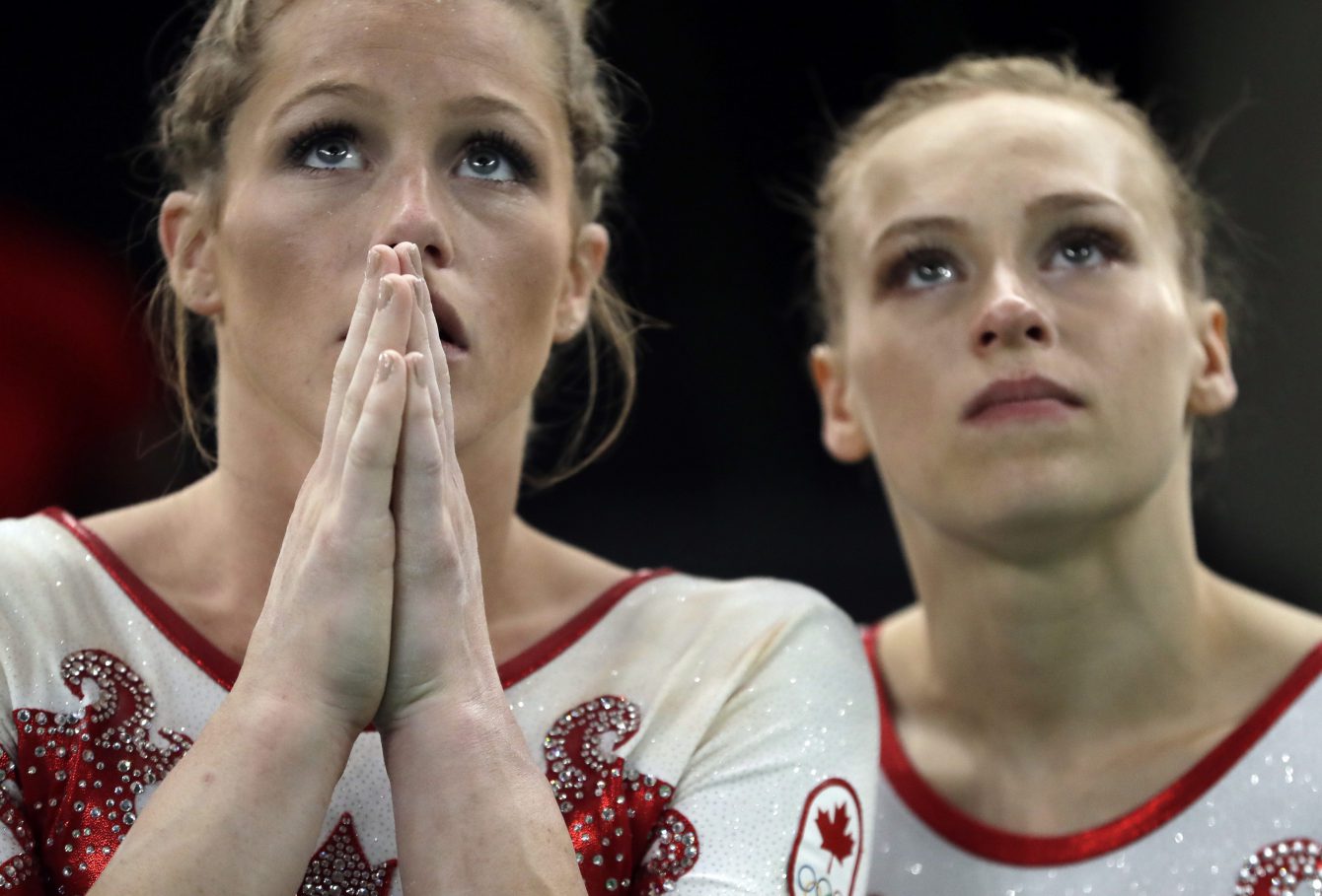 Brittany Rogers and Ellie Black, Rio 2016. Aug. 7, 2016. (AP Photo/Julio Cortez)