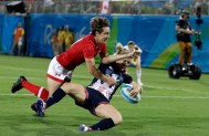 Great Britain's Danielle Waterman, right, scores a try as Canada's Ghislaine Landry, defends during the women's rugby sevens bronze medal match at the Summer Olympics in Rio de Janeiro, Brazil, Monday, Aug. 8, 2016. (AP Photo/Themba Hadebe)