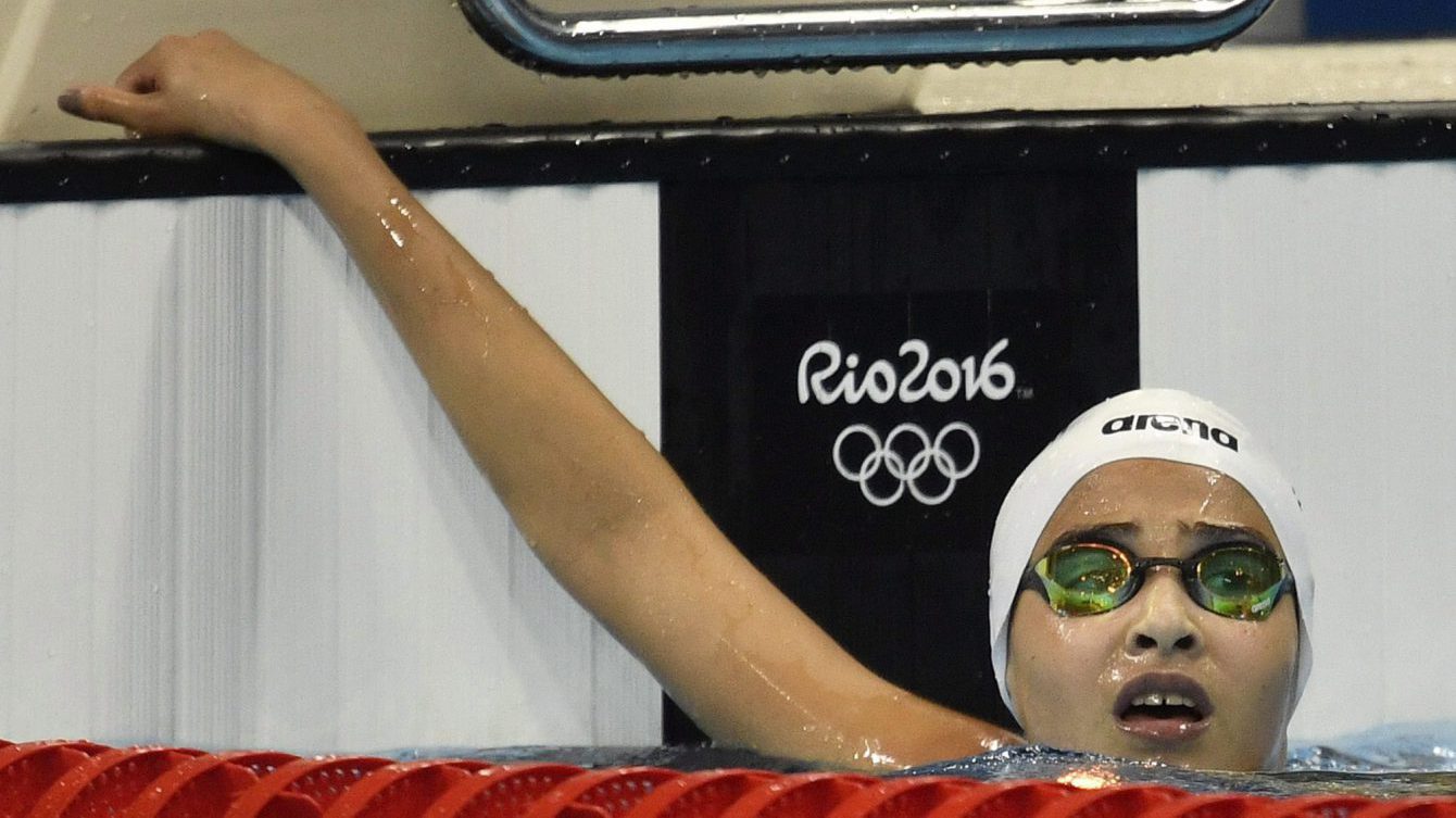 Yusra Mardini, swimming for the Refugee Olympic Team, competes in a women's 100-meter freestyle heat during the swimming competitions at the 2016 Summer Olympics, Wednesday, Aug. 10, 2016, in Rio de Janeiro, Brazil. (AP Photo/Martin Meissner)