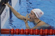 Canada's Hilary Caldwell celebrates winning a semifinal of the women's 200-meter backstroke during the swimming competitions at the 2016 Summer Olympics, Thursday, Aug. 11, 2016, in Rio de Janeiro, Brazil. (AP Photo/Natacha Pisarenko)