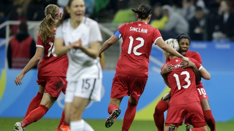 Rio Olympics Soccer Women Canada's Sophie Schmidt, 13, celebrates with teammate Canada's Ashley Lawrence celebrates after scoring her team's first goal during a quarter-final match of the women's Olympic football tournament between Canada and France in Sao Paulo, Brazil, Friday Aug. 12, 2016.(AP Photo/Nelson Antoine)