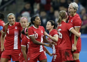 APTOPIX Rio Olympics Soccer Women Canada's Sophie Schmidt, right, celebrates after scoring her team's first goal during a quarter-final match of the women's Olympic football tournament between Canada and France in Sao Paulo, Brazil, Friday Aug. 12, 2016.(AP Photo/Nelson Antoine)