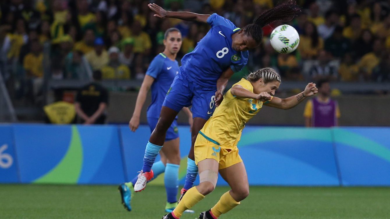 Brazil's Formiga, left, jumps for a header over Australia's Katrina Gorry during a quarter-final match of the women's Olympic football tournament between Brazil and Australia at the Mineirao Stadium in Belo Horizonte, Brazil, Friday Aug. 12, 2016. (AP Photo/Eugenio Savio)