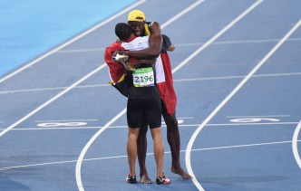 Canada's Andre De Grasse, left, and Jamaica's Usain Bolt share a moment after racing in the men's 100-metre final during the athletics competition at the 2016 Olympic Summer Games in Rio de Janeiro, Brazil on Sunday, August 14, 2016. THE CANADIAN PRESS/Sean Kilpatrick