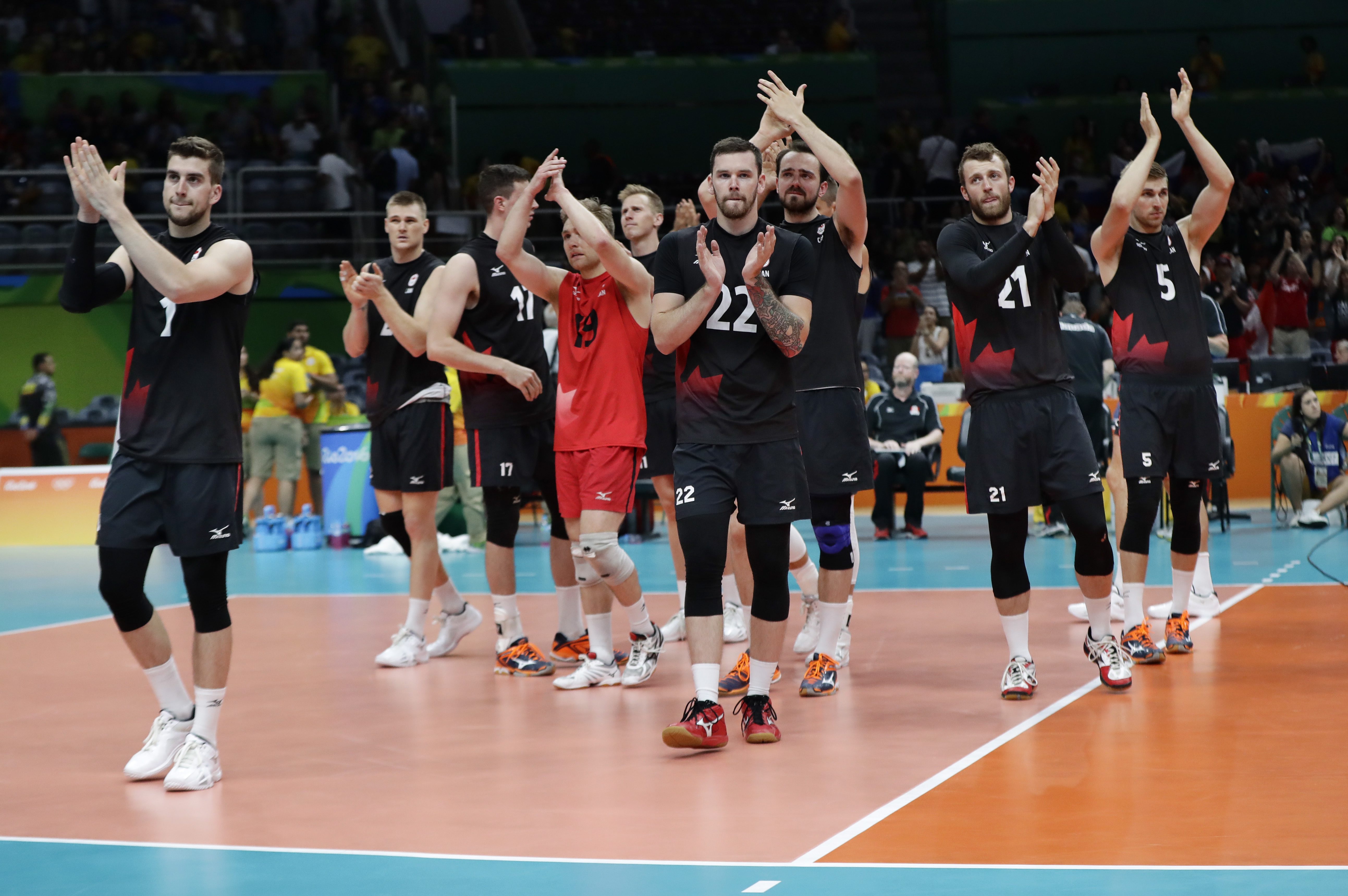 Canada's players applaud their fans after losing to Russia in straight sets in a men's quarterfinal volleyball match at the 2016 Summer Olympics in Rio de Janeiro, Brazil, Wednesday, Aug. 17, 2016. (AP Photo/Robert F. Bukaty)