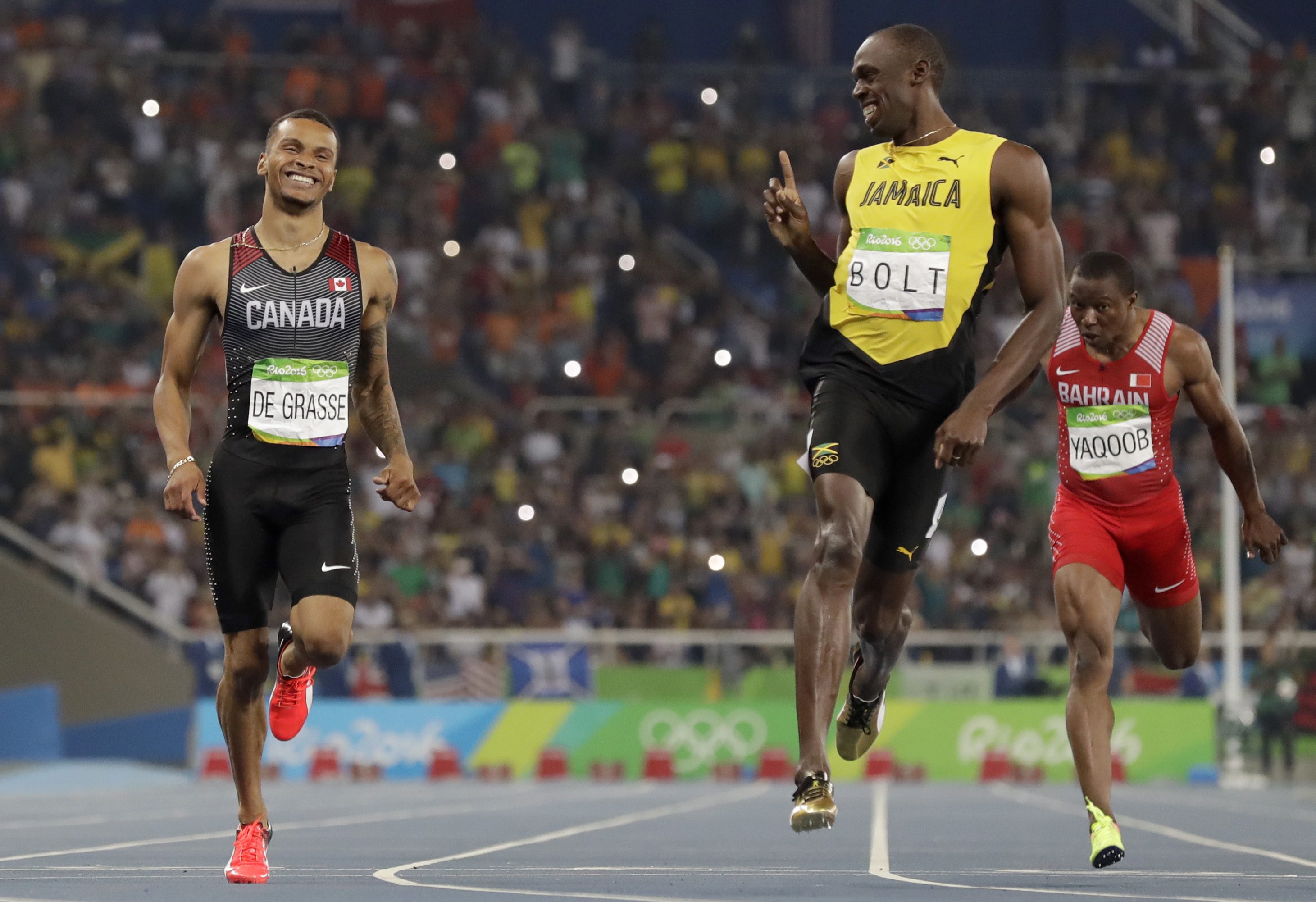 Jamaica's Usain Bolt, right, and Canada's Andre De Grasse compete in a men's 200-meter semifinal during the athletics competitions of the 2016 Summer Olympics at the Olympic stadium in Rio de Janeiro, Brazil, Wednesday, Aug. 17, 2016. (AP Photo/David J. Phillip)
