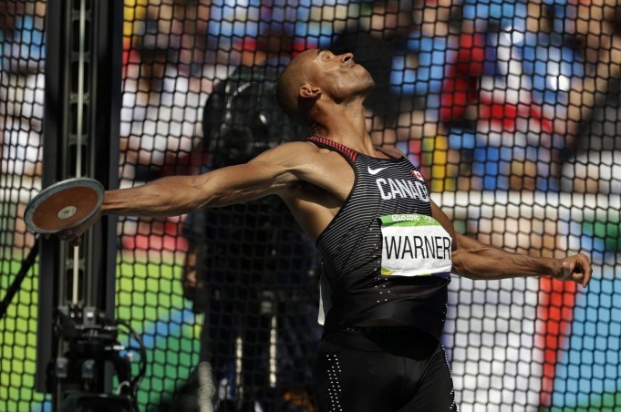 Canada's Damian Warner makes an attempt in the decathlon discus throw, during the athletics competitions of the 2016 Summer Olympics at the Olympic stadium in Rio de Janeiro, Brazil, Thursday, Aug. 18, 2016. (AP Photo/Matt Dunham)