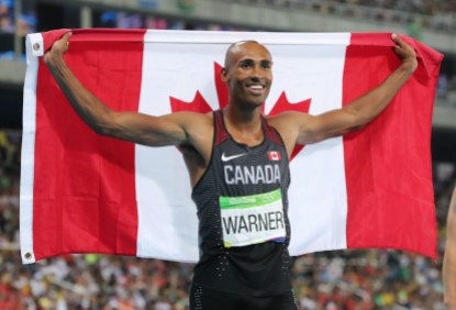 Rio 2016: Damien Warner Damian Warner holds a Canadian flag