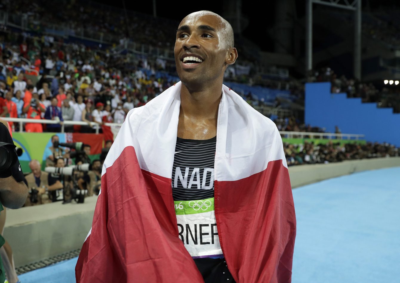 Canada's Damian Warner celebrates after winning the bronze medal in the decathlon, during the athletics competitions of the 2016 Summer Olympics at the Olympic stadium in Rio de Janeiro, Brazil, Thursday, Aug. 18, 2016. (AP Photo/Matt Slocum)