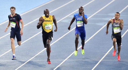 Rio 2016: Andre De Grasse 200m Usain Bolt, second left, wins the gold medal in the men's 200-meter final ahead of second placed Canada's Andre De Grasse, right, and third placed France's Christophe Lemaitre, left, during the athletics competitions of the 2016 Summer Olympics at the Olympic stadium in Rio de Janeiro, Brazil, Thursday, Aug. 18, 2016. (AP Photo/Martin Meissner)