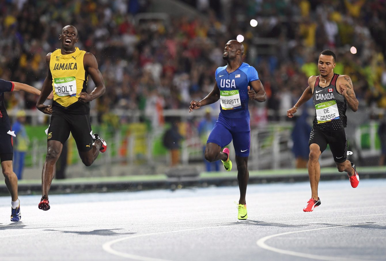 Jamaica's Usain Bolt, left to right, United States' Lashawn Merritt and Canada's Andre De Grasse react after crossing the finish line in the men's 200-metre final at the 2016 Summer Olympics in Rio de Janeiro, Brazil on Thursday, August 18, 2016. THE CANADIAN PRESS/Frank Gunn