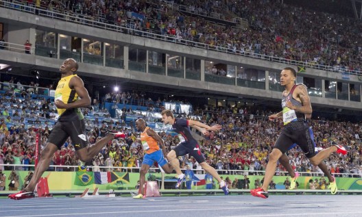 Rio 2016: Andre De Grasse 200m Jamaica's Usain Bolt, left, celebrates his gold medal performance as Canada's Andre De Grasse, right, follows for silver in the men's 200-metre at the Olympic games in Rio de Janeiro, Brazil, Thursday August 18, 2016. THE CANADIAN PRESS/Frank Gunn