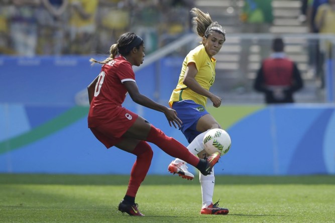Rio 2016: Women's soccer bronze Brazil's Marta, right, and Canada's Ashley Lawrence compete for the ball during the bronze medal match of the women's Olympic football tournament between Brazil and Canada at the Arena Corinthians stadium in Sao Paulo, Friday Aug. 19, 2016. (AP Photo/Nelson Antoine)