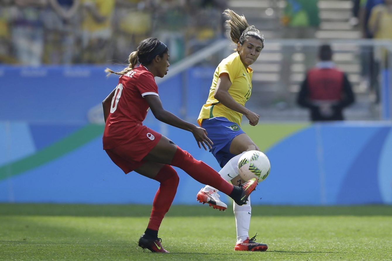 Brazil's Marta, right, and Canada's Ashley Lawrence compete for the ball during the bronze medal match of the women's Olympic football tournament between Brazil and Canada at the Arena Corinthians stadium in Sao Paulo, Friday Aug. 19, 2016. (AP Photo/Nelson Antoine)