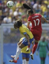 Canada's Jessie Fleming, right, heads the ball challenged by Brazil's Marta during the bronze medal match of the women's Olympic football tournament between Brazil and Canada at the Arena Corinthians stadium in Sao Paulo, Friday Aug. 19, 2016. (AP Photo/Nelson Antoine)