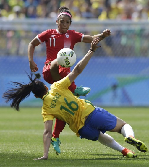 Rio 2016: Women's soccer bronze Canada's Desiree Scott, top, kicks the ball under pressure by Brazil's Beatriz during the bronze medal match of the women's Olympic football tournament between Brazil and Canada at the Arena Corinthians stadium in Sao Paulo, Friday Aug. 19, 2016. (AP Photo/Nelson Antoine)
