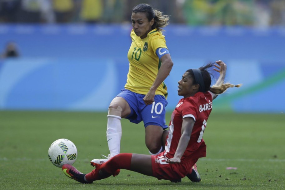 Rio 2016: Women's soccer bronze Brazil's Marta is challenged by Canada's Ashley Lawrence during the bronze medal match of the women's Olympic football tournament between Brazil and Canada at the Arena Corinthians stadium in Sao Paulo, Friday Aug. 19, 2016. (AP Photo/Nelson Antoine)