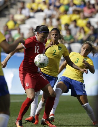 Rio 2016: Women's soccer bronze Canada's Christine Sinclair, left, scores her side's 2nd goal during the bronze medal match of the women's Olympic football tournament between Brazil and Canada at the Arena Corinthians stadium in Sao Paulo, Friday Aug. 19, 2016. (AP Photo/Nelson Antoine)