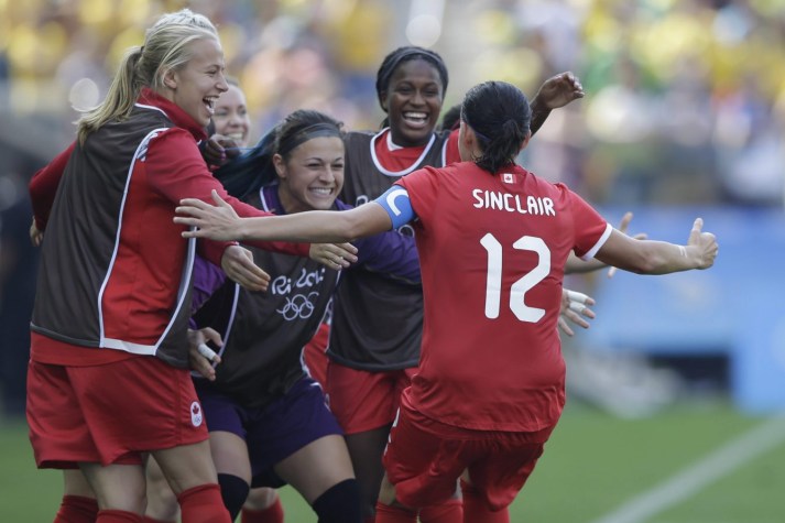 Rio 2016: Women's soccer bronze Canada's Christine Sinclair, 12, is congratulated after scoring her side's 2nd goal during the bronze medal match of the women's Olympic football tournament between Brazil and Canada at the Arena Corinthians stadium in Sao Paulo, Friday Aug. 19, 2016. (AP Photo/Nelson Antoine)