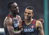 Canada's Andre De Grasse, right, and Brendon Rodney react following the men's 4x100-metre relay final at the 2016 Summer Olympics in Rio de Janeiro, Brazil on Friday, August 19, 2016. THE CANADIAN PRESS/Frank Gunn