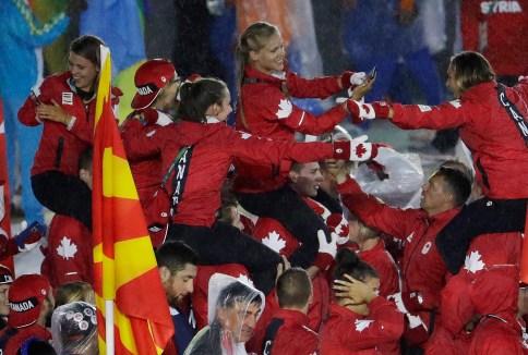 Athletes are carried on the shoulders of teammates of the Canadian team as they march in during the closing ceremony in the Maracana stadium at the 2016 Summer Olympics in Rio de Janeiro, Brazil, Sunday, Aug. 21, 2016. (AP Photo/Natacha Pisarenko)