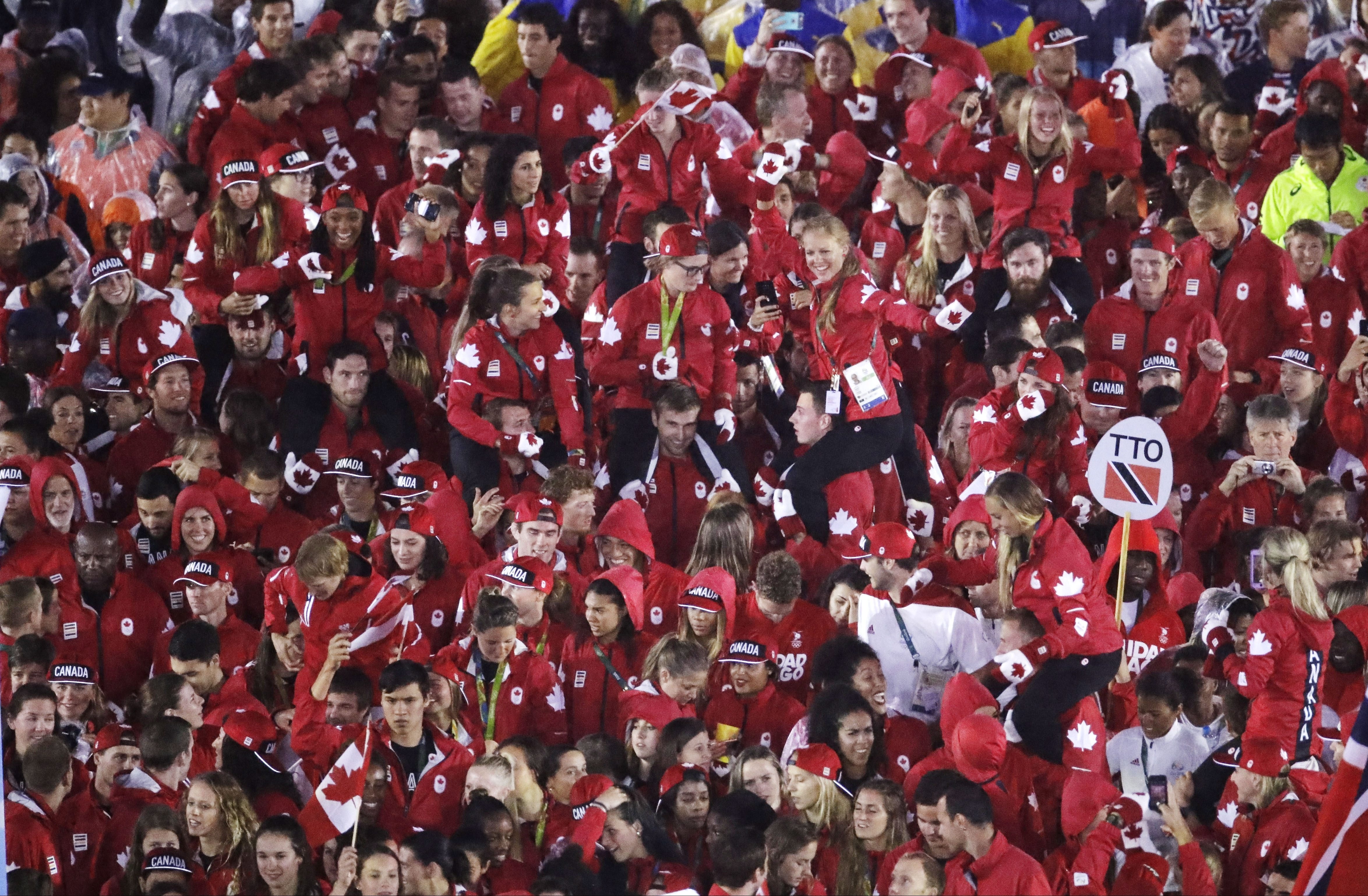 Athletes from Canada march into the closing ceremony in the Maracana stadium at the 2016 Summer Olympics in Rio de Janeiro, Brazil, Sunday, Aug. 21, 2016. (AP Photo/Charlie Riedel)