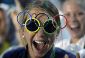 Jackie Briggs from the United States wears the Olympic ring sunglasses during the closing ceremony in the Maracana stadium at the 2016 Summer Olympics in Rio de Janeiro, Brazil, Sunday, Aug. 21, 2016. (AP Photo/David Goldman)
