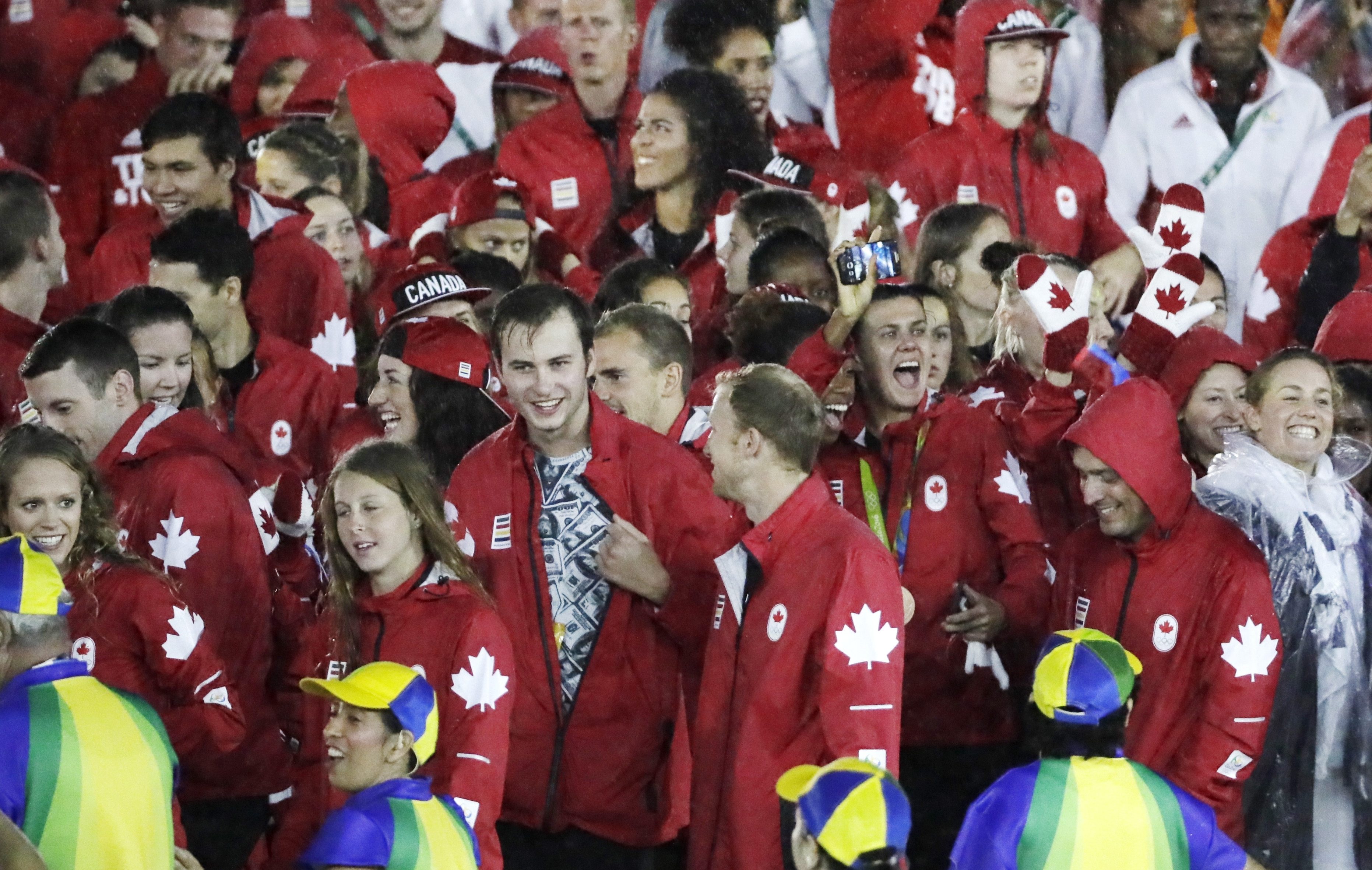 Canadian athletes celebrate during the closing ceremony in the Maracana stadium at the 2016 Summer Olympics in Rio de Janeiro, Brazil, Sunday, Aug. 21, 2016. (AP Photo/Mark Humphrey)