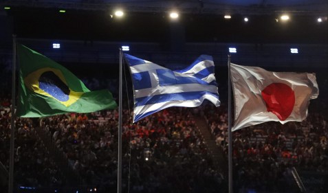 The Brazilian, Greek and Japanese flutter during the closing ceremony in the Maracana stadium at the 2016 Summer Olympics in Rio de Janeiro, Brazil, Sunday, Aug. 21, 2016. (AP Photo/David Goldman)