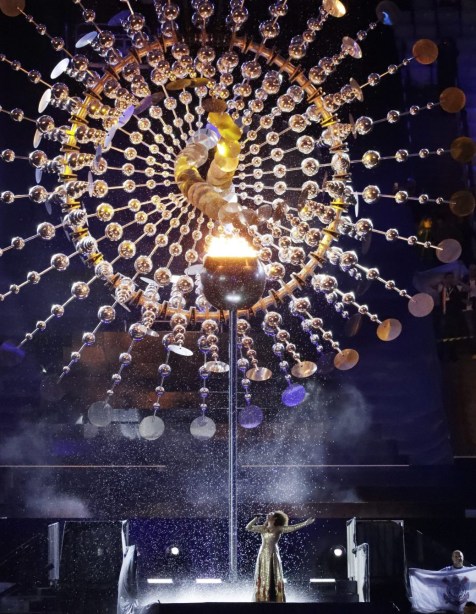 Mariene de Castro sings under the Olympic Cauldron during the closing ceremony in the Maracana stadium at the 2016 Summer Olympics in Rio de Janeiro, Brazil, Sunday, Aug. 21, 2016. (AP Photo/Mark Humphrey)