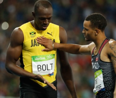 Rio 2016: De Grasse 200m-9-2 Andre De Grasse who finished second, congratulates Usain Bolt on his gold medal win in Rio on August 18, 2016. (photo/ Mark Blinch)